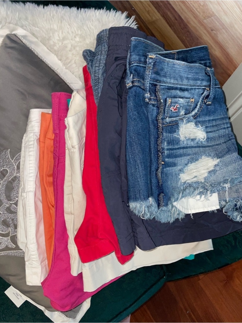 Stack of Women's Shorts in Denim, Pink, Red, Orange, White